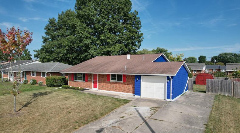 The front of the home has a two-car attached garage, concrete driveway and updated front door and storm door. Contributed