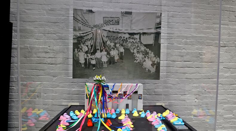 The Heritage Center is holding a free children’s craft program, “Peeps in History,” on Wednesday for ages 5-10.
Natalie Fritz, Archivist and Outreach Director for the Clark County Historical Society at the Heritage Center, and her band of volunteer marshmallow Peep artists recreated another historic Clark County picture on March 22 for their "Peeps in History" display. This year they recreated a 1948 May Pole program photo from Elmwood Elementary. The Peeps will be on display in the lobby of the Clark County Heritage Center until after Easter. BILL LACKEY/STAFF