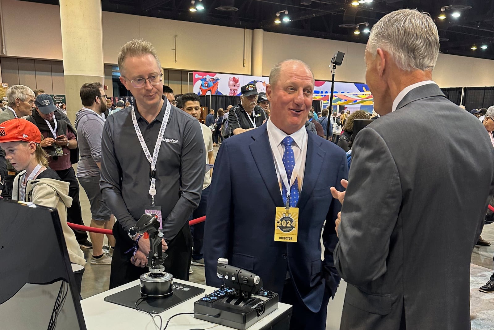 FILE - Berkshire Hathaway Vice Chairman Greg Abel checks out the flight simulators offered by one of Berkshires companies, Flight Safety as he toured the exhibit hall Friday, May 3, 2024, in Omaha, Neb. ahead of Saturday's meeting. (AP Photo/Josh Funk, File)