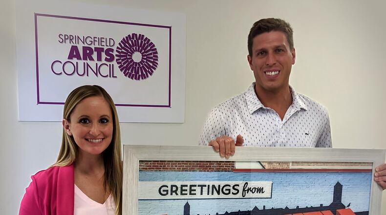 Event chairs Bridget Houston and Greg Rogers display raffle tickets and one of the art pieces that will be for auction for the Springfield Arts Council's 44th annual Salute to the Arts Benefit Auction. The auction, which will be done virtually, will feature up to 40 items including vacations, getaways, art and more beginning April 10 through May 1. Proceeds benefit the Arts Council's programs including the Summer Arts Festival. Contributed photo