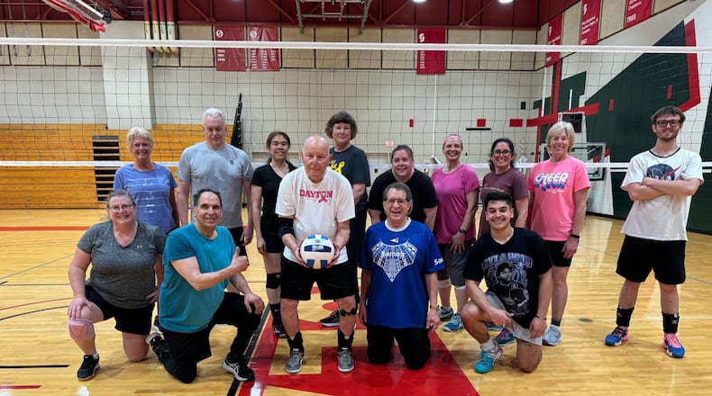 Lou Schweickart (holding volleyball) with his Sinclair Saturday morning volleyball class. CONTRIBUTED