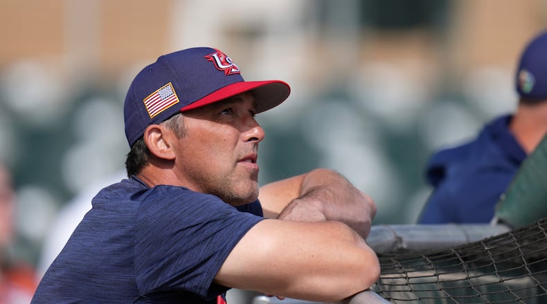 United States manager Mark DeRosa watches batting practice prior to an exhibition baseball game against the Colorado Rockies Wednesday, March 4, 2026, in Scottsdale, Ariz. (AP Photo/Ross D. Franklin)
