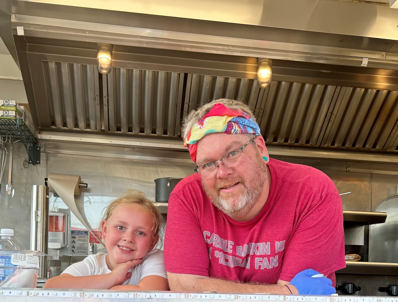 The Director’s Cut Food Truck is now serving wraps outside of the Fairborn Phoenix at 34 S. Broad St. Pictured is owner Jonathan Gum (right) with his daughter, Giana.