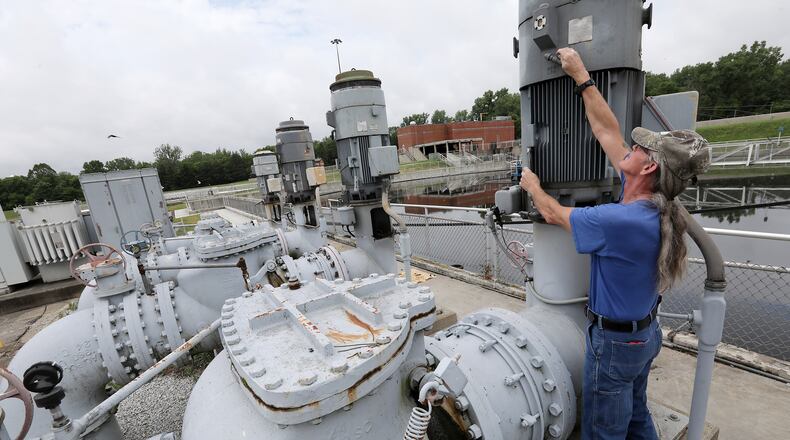 Virgil Hoskins works on one of the pumps that will be replaced soon at the Springfield Wastewater Treatment Plant. BILL LACKEY/STAFF