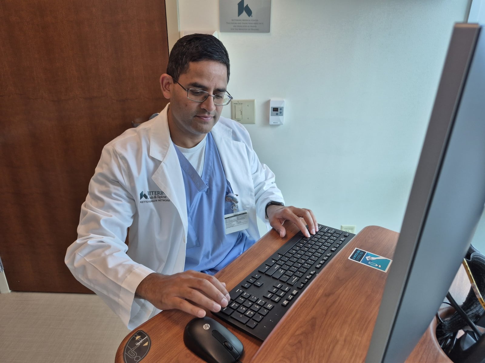Dr. Akil Patel, a lead neurosurgeon with Kettering Health, said he sees more patients asking about ways to protect their mental acuity as they age. MICHAEL KURTZ / STAFF