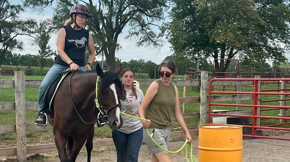 Horse Oliver’s first test ride with a volunteer at Autumn Trails Stable. CONTRIBUTED