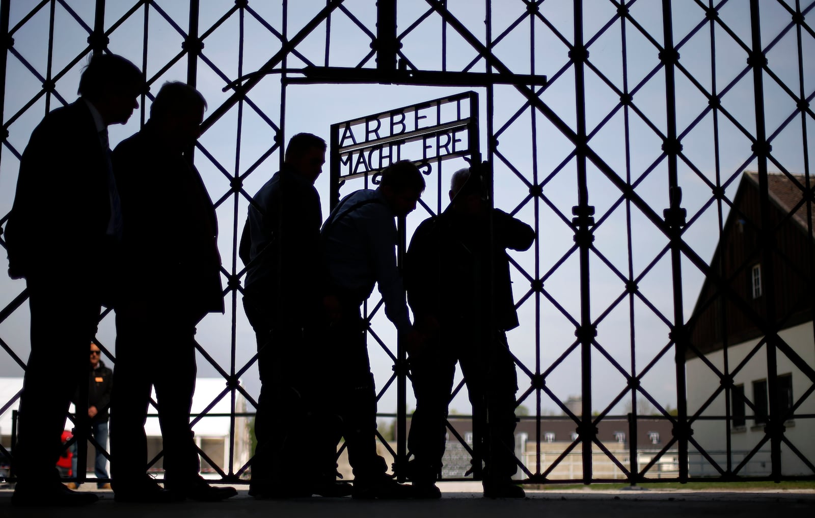 FILE - A Wednesday, April 29, 2015 file photo showing blacksmiths preparing a replica of the Dachau Nazi concentration camp gate, with the writing "Arbeit macht frei" (Work Sets you Free) at the main entrance of the memorial in Dachau, Germany. (AP Photo/Matthias Schrader, File)