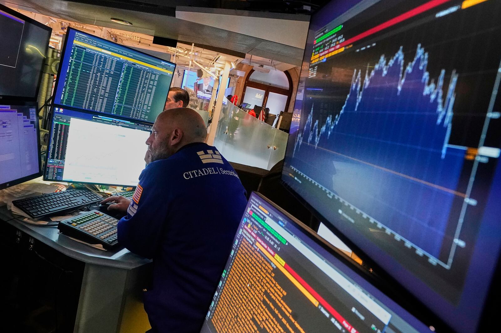 Specialist Meric Greenbaum works at his post on the floor of the New York Stock Exchange, Tuesday, June 10, 2025. (AP Photo/Richard Drew)