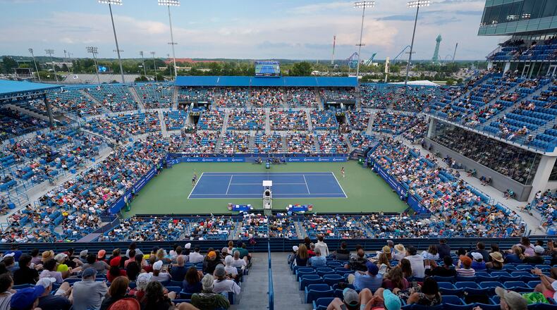 Borna Coric, left, of Croatia, serves to Stefanos Tsitsipas, of Greece, during the men's singles final of the Western & Southern Open tennis tournament Sunday, Aug. 21, 2022, in Mason, Ohio. (AP Photo/Jeff Dean)