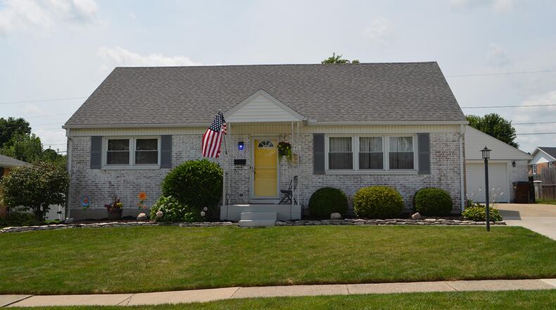 The 3-bedroom, Cape Cod-style home offers about 1,665 sq. ft. of living space. The front of the whitewashed, brick home features a covered concrete porch and a walkway leading to the driveway and a 2-car, detached garage. CONTRIBUTED PHOTO