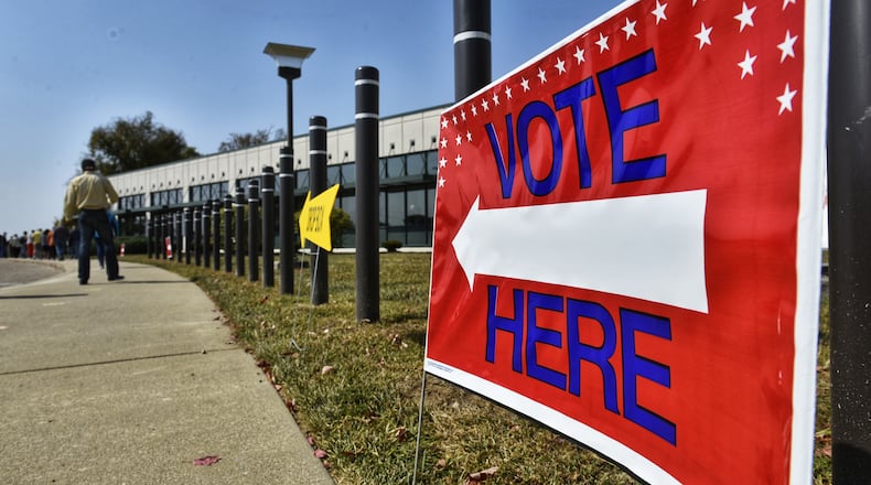 Voters line up at the Butler County Board of Elections on the first day of early voting Tuesday, October 6, 2020 in Hamilton. NICK GRAHAM / STAFF