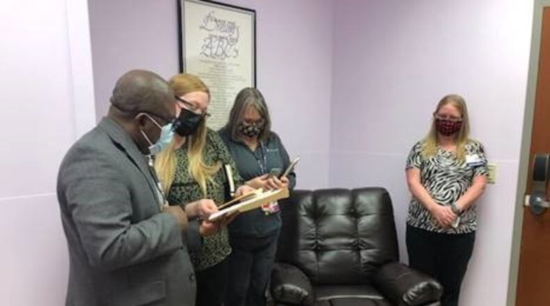 People stand in one of the lavender rooms that have been added to Mercy Health's hospitals in Springfield and Urbana. (Contributed)