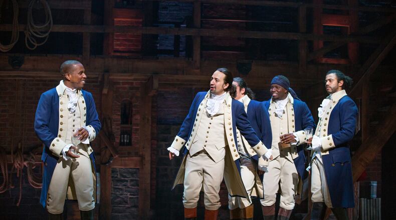 FILE -- From left, Leslie Odom Jr., Lin-Manuel Miranda, Anthony Ramos, Okieriete Onaodowan and Daveed Diggs in "Hamilton" at the Richard Rodgers Theater in New York, July 11, 2015. Disney announced Tuesday, May 12, 2020, that it plans to stream a filmed version of the stage production beginning July 3 on Disney Plus. (Sara Krulwich/The New York Times)