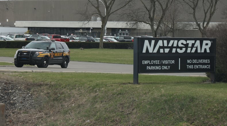 A Clark County Sheriff's cruiser leaves Navistar plant Thursday. BILL LACKEY/STAFF