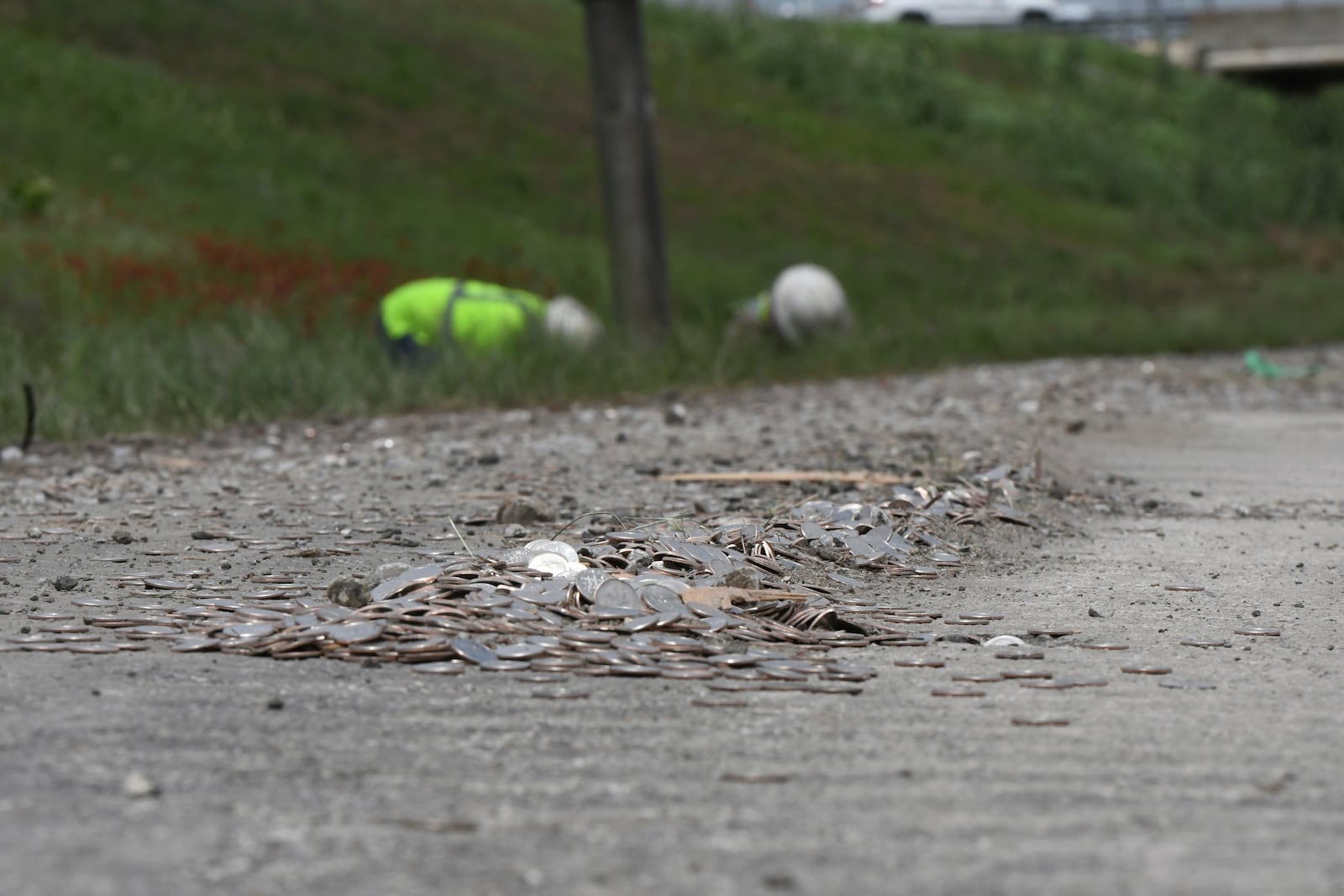This image provided by the Wise County Messenger shows uncirculated dimes scattered across U.S. 81/287 after a rollover accident involving an 18-wheeler, Tuesday, April 29, 2025 in Alvord, Texas. (Austin Jackson/Wise County Messenger via AP)