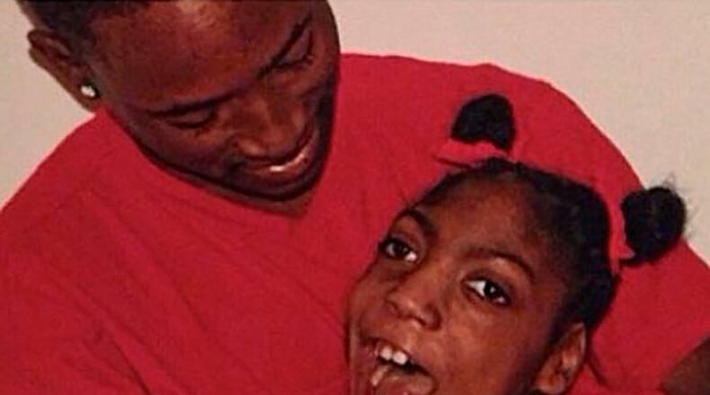 In this undated family photo provided by Erica Lattimore through Fieger Law shows her daughter, Timesha Beauchamp with her brother Steven Thompson in Southfield, Mich. Michigan authorities have agreed to reinstate the licenses of two suburban Detroit paramedics if they pass a national exam, after Timesha Beauchamp declared dead on their watch was discovered to be alive at a funeral home. Beauchamp was declared dead only to be found alive at a funeral home in August 2020. Beauchamp died on Oct. 18, 2020 at Children's Hospital in Detroit. (Courtesy Erica Lattimore through Fieger Law via AP)