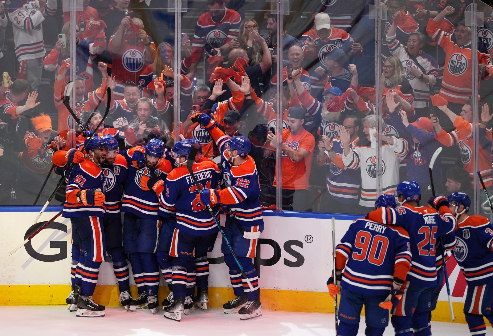 Edmonton Oilers' Leon Draisaitl (second left) celebrates his game-winning goal against the Florida Panthers with teammates in the first overtime period in Game 1 of the NHL Stanley Cup Final, in Edmonton, Alberta, on Wednesday, June 4, 2025. (Darryl Dyck/The Canadian Press via AP)