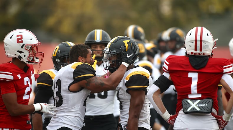 DePauw celebrates Caden Whitehead's game-winning touchdown run in overtime against Wittenberg on Saturday, Oct. 21, 2023, at Edwards-Maurer Field in Springfield. David Jablonski/Staff