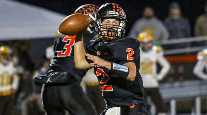 West Liberty-Salem quarterback Trevor Woodruff throws a pass during a game against West Jefferson earlier this season at Tiger Stadium. West Liberty-Salem won 42-39. CONTRIBUTED PHOTO BY MICHAEL COOPER