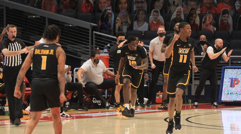 Virginia Commonwealth's Vince Williams reacts after making a 3-pointer against Dayton on Tuesday, Feb. 9, 2021, at UD Arena in Dayton. David Jablonski/Staff