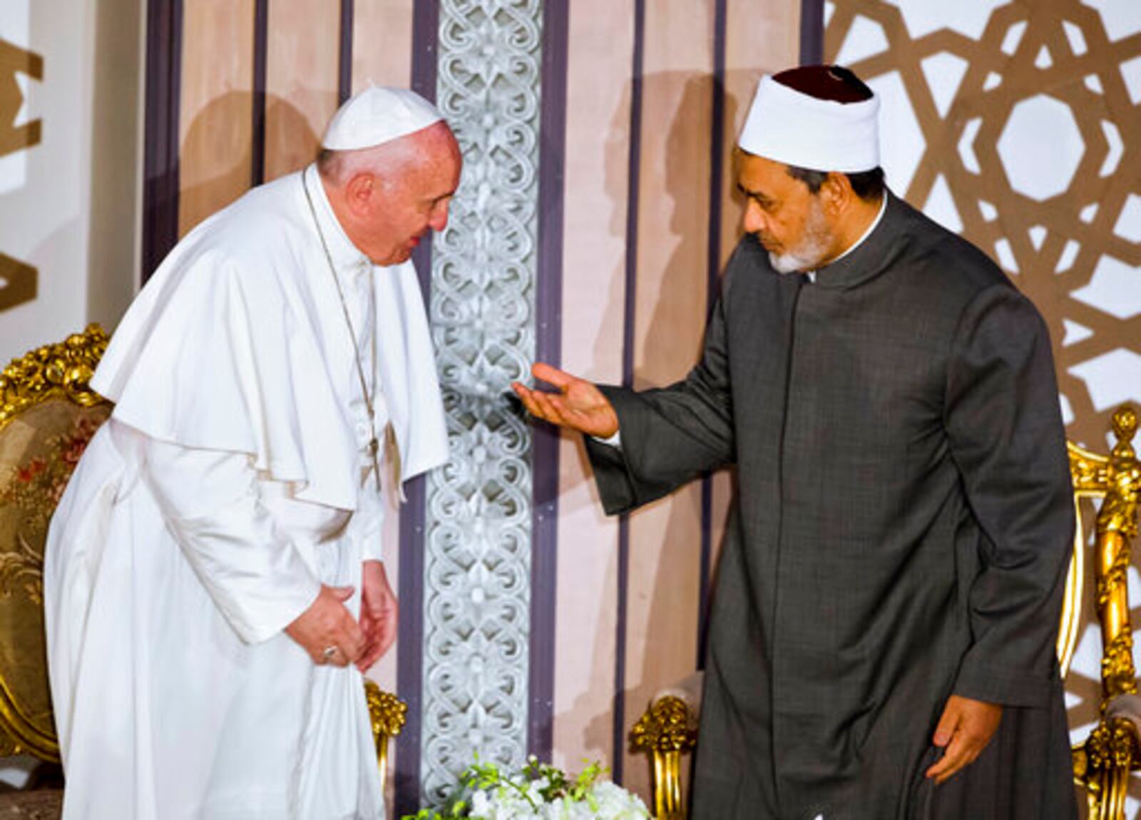 FILE - Sheikh Ahmed el-Tayeb, right, Grand Imam of Al-Azhar, the pre-eminent institute of Islamic learning in the Sunni Muslim world, right, welcomes Pope Francis at the international peace conference in Cairo, Egypt, Friday, April 28, 2017. (AP Photo/Amr Nabil, file)