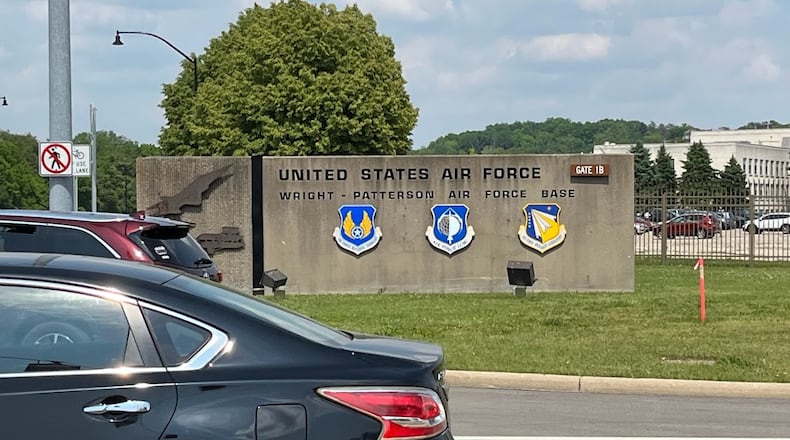 Vehicles leaving gate 1B at Wright-Patterson Air Force Base Tuesday afternoon. THOMAS GNAU/STAFF
