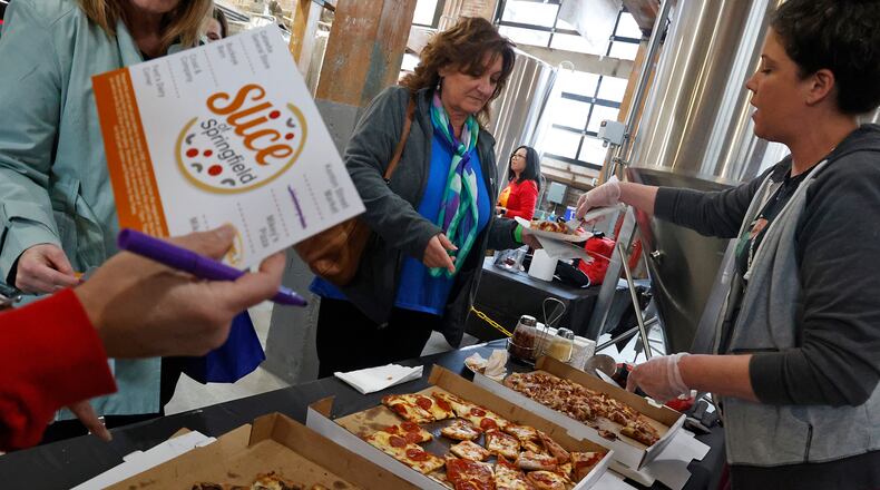 Some of the best pizza places in Clark County went head-to-head Thursday Feb. 9, 2023 to see who was supreme in the Slice of Springfield competition at Mother Stewart's Brewery. Hundreds of people were in attendance to sample pizza from each of the competitors and vote on their favorite. The event, sponsored by Mother Stewart's, National Trail Parks and Recreation District and Partners for the Parks, featured pizza from The Hickory Inn, Crust & Company, Buckeye Barn, Mikey's Pizza, Station #1, Fent's Dairy, Catawba General Store and Mike & Rosy's Press Box. BILL LACKEY/STAFF