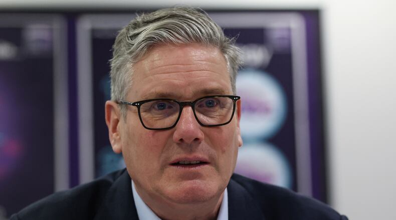 British Prime Minister Sir Keir Starmer speaks with students and staff, during a visit to the Walbottle Academy Campus in Newcastle-upon-Tyne, England, Thursday, Feb. 26, 2026. (Scott Heppell/PA via AP)