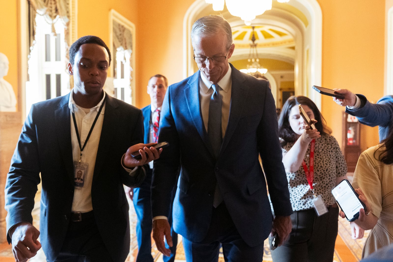 Senate Majority Leader John Thune, R-S.D., is followed by reporters as he walks from the chamber to his office as Republicans begin a final push to advance President Donald Trump's tax breaks and spending cuts package, at the Capitol in Washington, Monday, June 30, 2025. (AP Photo/Manuel Balce Ceneta)