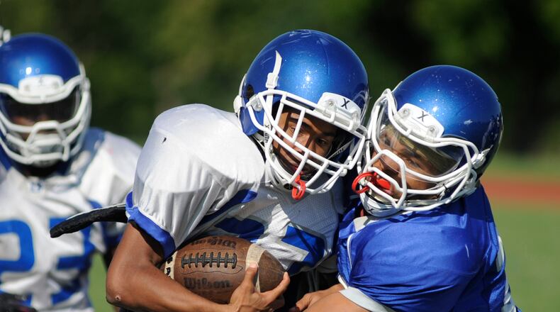 Dunbar football players participate in a preseason practice on Wednesday, Aug. 22, 2018. MARC PENDLETON / STAFF