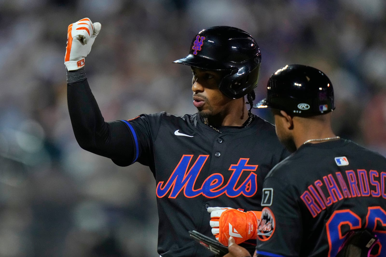 New York Mets' Francisco Lindor gestures to teammates after hitting an RBI single during the sixth inning in the second baseball game against the Milwaukee Brewers of a doubleheader Wednesday, July 2, 2025, in New York. (AP Photo/Frank Franklin II)