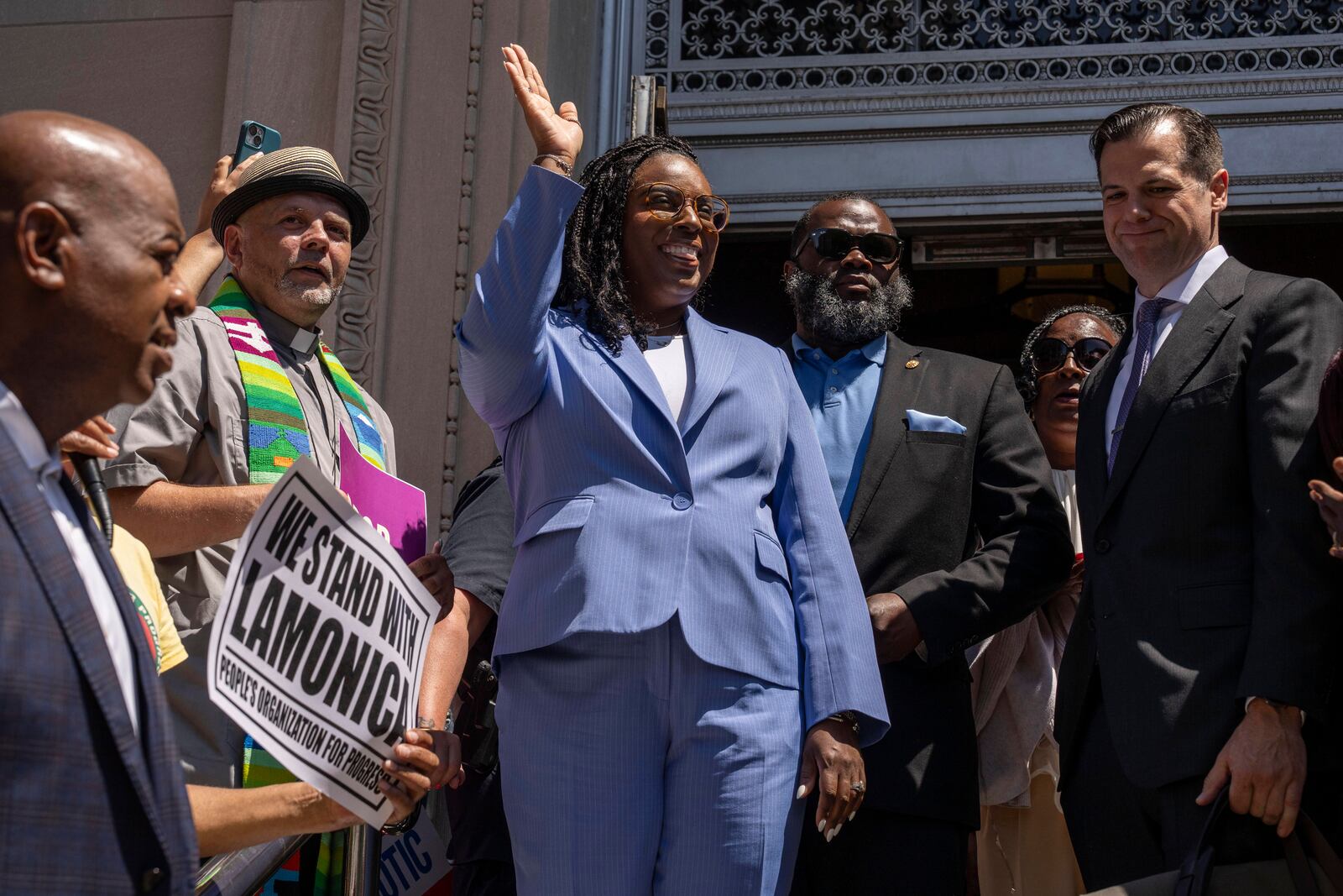 Rep. LaMonica Mclver (D-10th) waves at supporters as she exits a federal court Wednesday, June 25, 2025, in Newark, N.J. (AP Photo/Yuki Iwamura)