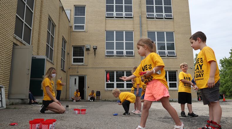 Clark-Shawnee Local School District is holding an online real estate auction for Rockway Elementary School. Students play games outside the school on the last day of classes in June. BILL LACKEY/STAFF BILL LACKEY/STAFF