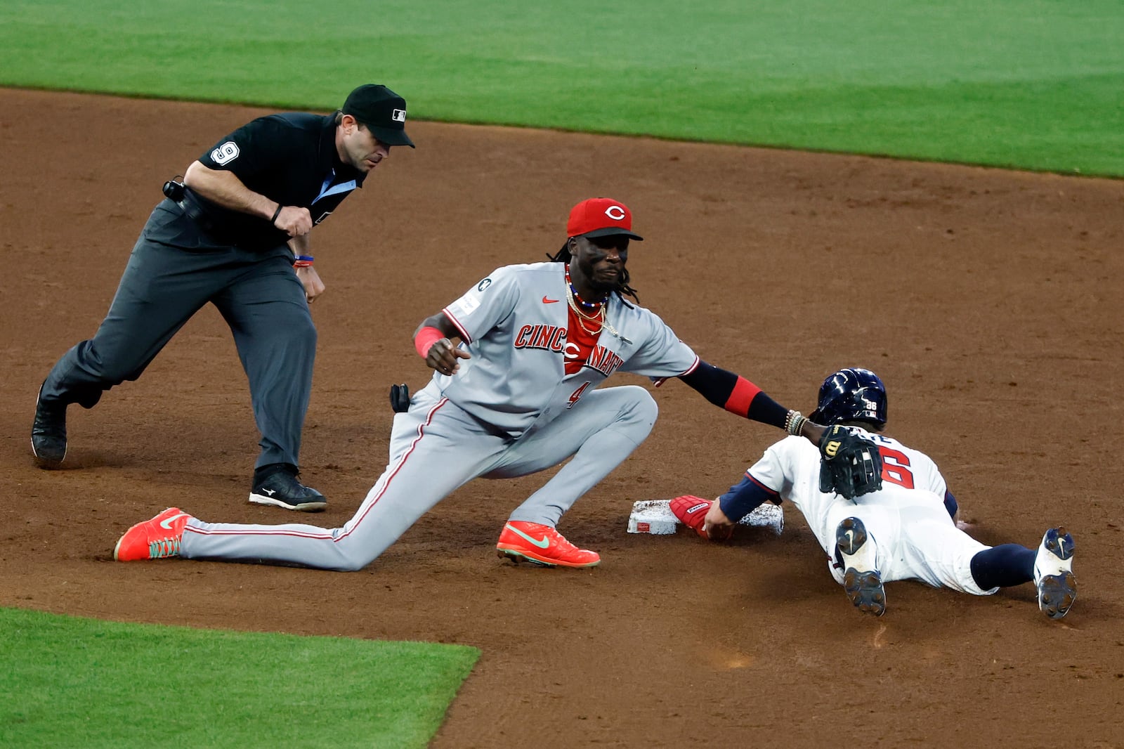 Atlanta Braves' Eli White (36) beats the tag from Cincinnati Reds shortstop Elly De La Cruz (44) as he slides into second base during the fifth inning of a baseball game, Thursday, May 8, 2025, in Atlanta. (AP Photo/Butch Dill)