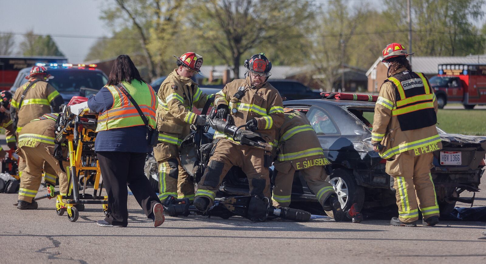 Authorities respond to the scene of a mock crash on Wednesday, April 23, 2025, at Tecumseh High School. The mock crash simulation was held to help prevent impaired and distracted driving. JOSEPH COOKE/STAFF

