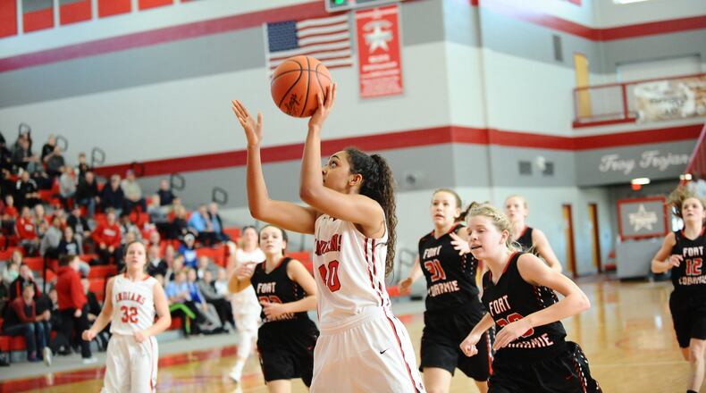 Cedarville senior Celeste Rucker drives for two of her eight points in the Division IV district final at Troy High School on Saturday. Cedarville lost to Fort Loramie 57-45. Greg Billing / Contributed