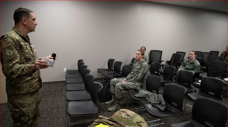Col. Raymond A. Smith, Jr., 445th Airlift Wing commander, briefs deploying members from the 445th Airlift Wing’s Aerospace Medicine and Aeromedical Staging Squadrons, earlier this week. Airmen from the 445th Airlift Wing were notified this past weekend that they would be mobilized to New York City to help with the COVID-19 pandemic. (U.S. Air Force photo/Mr. Patrick O’Reilly)