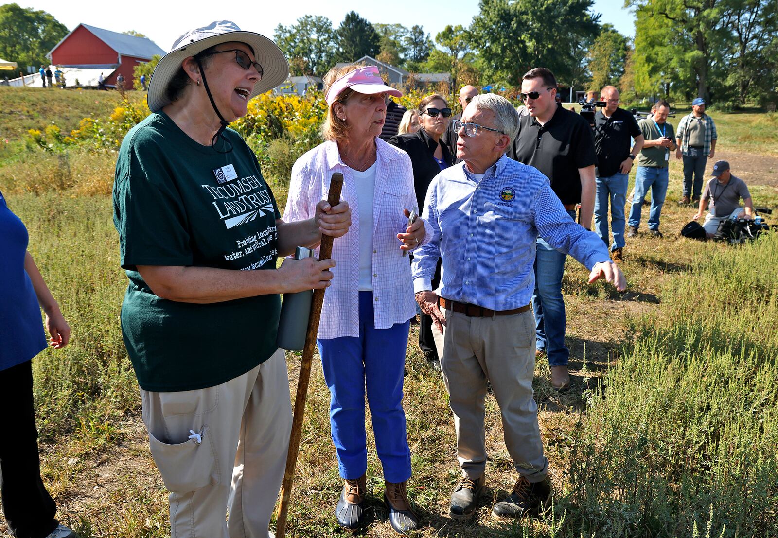 Gov. Mike DeWine and his wife, Fran, talk with Susan Miller, one of the owners of the land that was donated for the H2Ohio Rainbow Run Wetland on Old Clifton Road in Clark County Wednesday, Sept. 11, 2024. A ribbon cutting ceremony and dedication was held for the Tecumseh Land Trust wetland. BILL LACKEY/STAFF