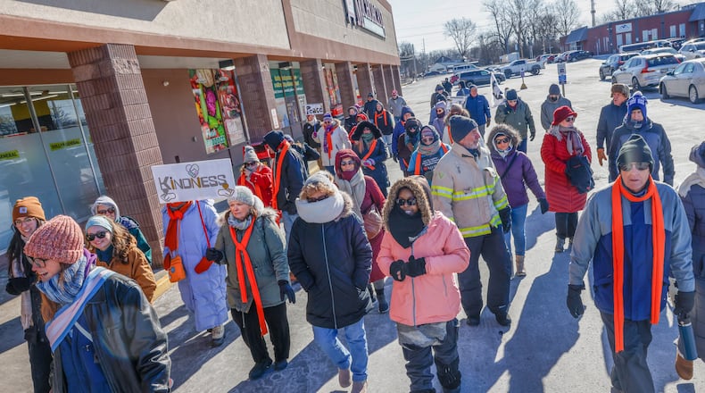 Marchers participate in a Peace Walk for the National Day of Action hosted by Indivisible Springfield on Tuesday, Jan. 20, 2026, in Springfield. JOSEPH COOKE/STAFF