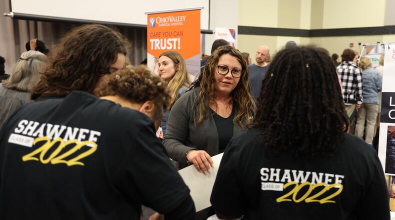 Karla Palencia, from KoneCranes, talks with some seniors from Shawnee High School during the an annual job fair in Clark County earlier this year. BILL LACKEY/STAFF