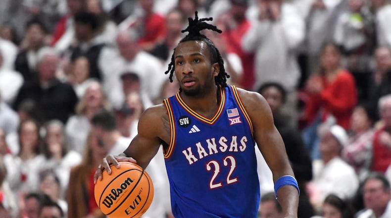 Kansas guard Darryn Peterson dribbles during the second half of an NCAA college basketball game against Texas Tech, Monday, Feb. 2, 2026, in Lubbock, Texas. (AP Photo/Annie Rice)