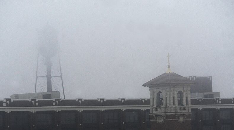 Fog covers downtown Dayton Thursday morning, Jan. 25, 2024. A Dense Fog Advisory is in effect for the entire Miami Valley now until 1 p.m. MARSHALL GORBY\STAFF
