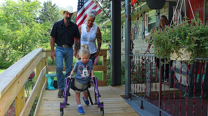 Donovan Puhala enjoys his new ramp while his grandparents Richard and Lori Robinson keep an watchful eye. JEFF GUERINI/STAFF