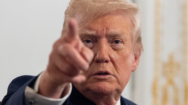 President Donald Trump speaks to reporters after speaking to troops via video from his Mar-a-Lago estate on Thanksgiving, Thursday, Nov. 27, 2025, in Palm Beach, Fla. (AP Photo/Alex Brandon)