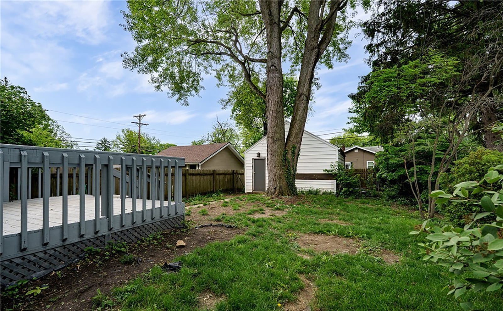 The detached two car garage sits at the back of the property and has an exterior door to the back yard.