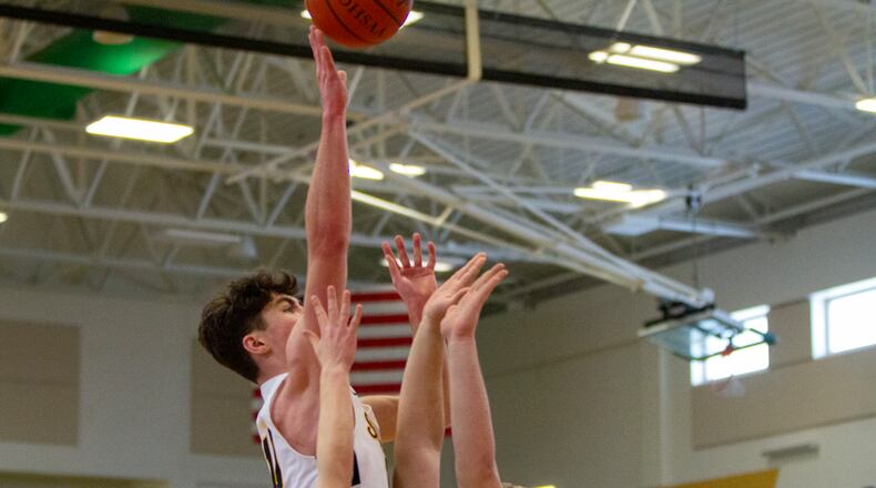 Shawnee's R.J. Griffin shoots over Anna defenders during Saturday's Division III district semifinal at Northmont. Jeff Gilbert/CONTRIBUTED