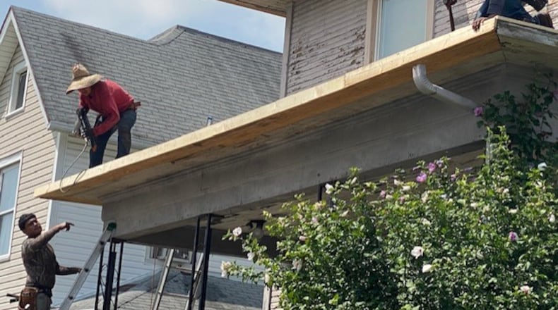 Non-profits Habitat for Humanity of Greater Dayton and Neighborhood Housing Partnership of Springfield helped provide a new roof for a Springfield senior citizen on West State Street last fall . CONTRIBUTED PHOTO