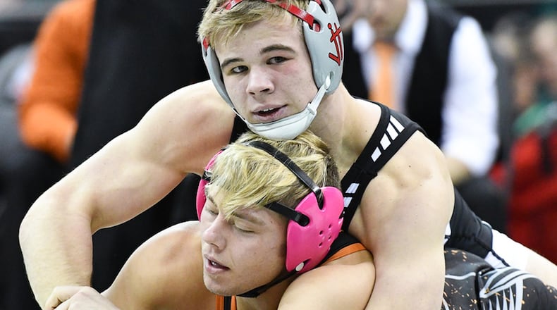 Graham’s Rocky Jordan (top) tries to pin Ashland’s Sid Ohi during the 152-pound Division II state match in 2017 at Value City Arena. Jordan won the title. Contributed Photo by Bryant Billing