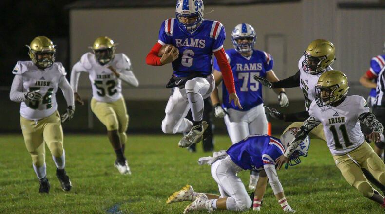 Greeneview High School quarterback Nick Clevenger leaps over a teammate during the Rams 66-8 victory over Catholic Central at Don Nock Field in Jamestown on Thursday, Oct. 18. Michael Cooper/CONTRIBUTED
