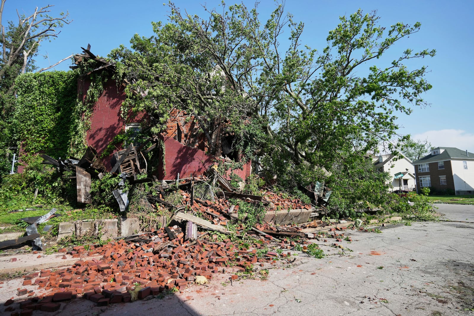 Debris is seen after a severe storm moved through Friday, May 16, 2025, in St. Louis. (AP Photo/Jeff Roberson)